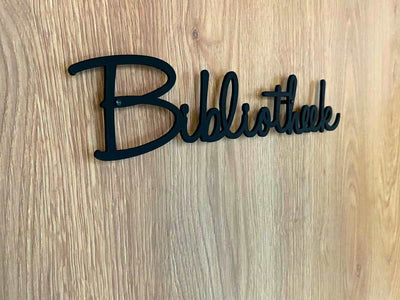 Metalen wandtekst op maat met het woord “Bibliotheek”